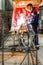 A welder is welding a steel billet for a pile.