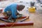 The welder is welding the structure on the floor