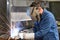 welder at work in a steel construction company - working and protective clothing