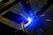 Welder at work in the workshop, welding products semi-automatic