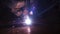 Welder worker performs jump welding. Worker welder performs arc-welding process of metal structures. Flying sparks from