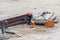 Welder working at construction site. Worker in helmet welds a me