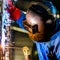 Welder working in industrial factory