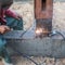 Welding metal and wood by electrode with bright electric arc