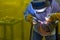 The welding operator welding the tube
