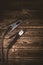 Welding wires on a wooden background. Place for the text. Studio photo in hard light