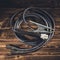 Welding wires on a wooden background. Studio photo in hard light