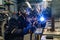 Welding work in an electromechanical workshop at a mechanical assembly site