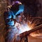 Welding worker in factory