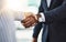 Well achieve new goals together. Closeup shot of two businesspeople shaking hands in an office.