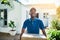 Well bring your package to you. Portrait of a young delivery man carrying a package during a delivery.