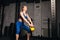 Well-built sexy ambitious girl performing exercises with kettlebell