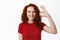 Well done. Smiling confident teen ginger girl showing OK sign, approve and agree, praise excellent choice and looking