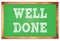 WELL DONE words on green wooden frame school blackboard