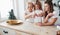 Well done, you`re already good at this. Mother, grandmother and daughter having good time in the kitchen