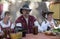 Well dressed group in renaissance outfit sitting at a table