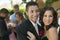 Well-dressed teenage couple embracing outside school dance