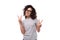 well-groomed cheerful energetic young european slim brunette woman with curly hair styling on a white background with