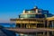 The well known pier jetty of Blankenberge beach, belgium, Touristic hot spot, Architecture of the belgian coast, colorful sky at