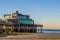 The well known pier jetty of Blankenberge, belgium, touristic holiday spot, belgian beach with beautiful and colorful sky
