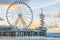 Well-known pier jetty of scheveningen beach the Netherlands with bungy jump tower and ferris wheel viewing on the ocean with