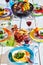 Well Laid summer table with colorful dish and brazier