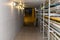 A well lit Maintenance Hallway in an industrial building with conduit running down the side