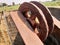 The well with mechanical pulley and green farms