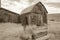 Well outside old barn in Bodie, California in sepia