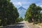A well paved two lane highway with the majestic Mount Mayon in the background. A road in the province of Albay
