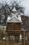 Well with a picturesque roof in the Carpathian village of Yaremche in winter. Ukraine