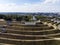 Well-planned walking area on the hill with the letters spelling out a Russian city\\\'s name on the top. A view from a height to