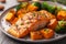 A well-plated dish featuring succulent grilled salmon accompanied by roasted sweet potatoes and steamed broccoli