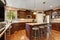 Well remodeled kitchen room interior with dark wood cabinets