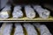 Well ripened goat and ewe cheeses in cellar ripening  with grey and white mould on metal shelves