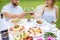 Well-serviced table with food and couple on the baclground