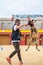 Well-trained Belgian Malinois performing obedience tricks during a competition