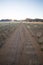 Well used, Dusty desert road to nowhere. Southern Namibia. Mountain scenery surrounding. Star sun.