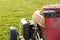 Well-used petrol powered lawn mower showing part of its fuel tank and petrol cap.