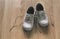 Well-worn heart-patterned baby girl shoes with shoelaces