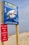 Wellfleet, Massachusetts /USA-8/11/18: Shark alert sign at Newcomb`s Hollow beach which was the site of a deadly shark attack.