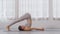 Wellness Attractive Asian indian woman practice yoga Plow pose or Halasana to meditation and breathing in bedroom after wake up