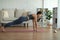 Wellness Attractive Asian woman look laptop practice yoga plank online course at home to meditation comfortable and relax,Health