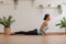 Wellness Attractive Asian woman practice yoga Cobra pose at home to meditation comfortable and relax,Calm of healthy young woman