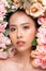 Wellness Beauty Asian Woman looking at camera bouquet of flowers around her face,Pretty young woman with clean and fresh skin