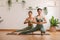 Wellness Couple Asian young woman stand on toe and heel on yoga mat doing breathing and balancing exercise together.Smile Yoga