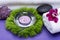 Wellness Relax concept with Spa elements. White Towels, Basalt Stones, Lavender Tea Light Candle, Dianthus Flowers and Amethyst