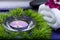 Wellness Relax concept with Spa elements. White Towels, Basalt Stones, Orchid, Lavender Tea Light Candle and Dianthus Flowers