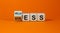 Wellness instead of stress. Turned a cube and changed the word `stress` to `wellness`. Beautiful orange background. Concept. C