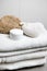 Wellness, white towels with pumice stone, peeling glove and cream jar